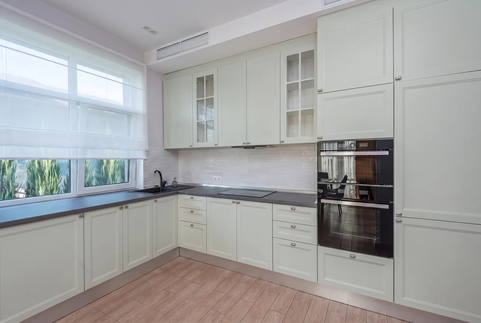 Kitchen cabinets rendered in Sherwin-Williams Sea Salt SW 6204, tile, counters and floor unchanged