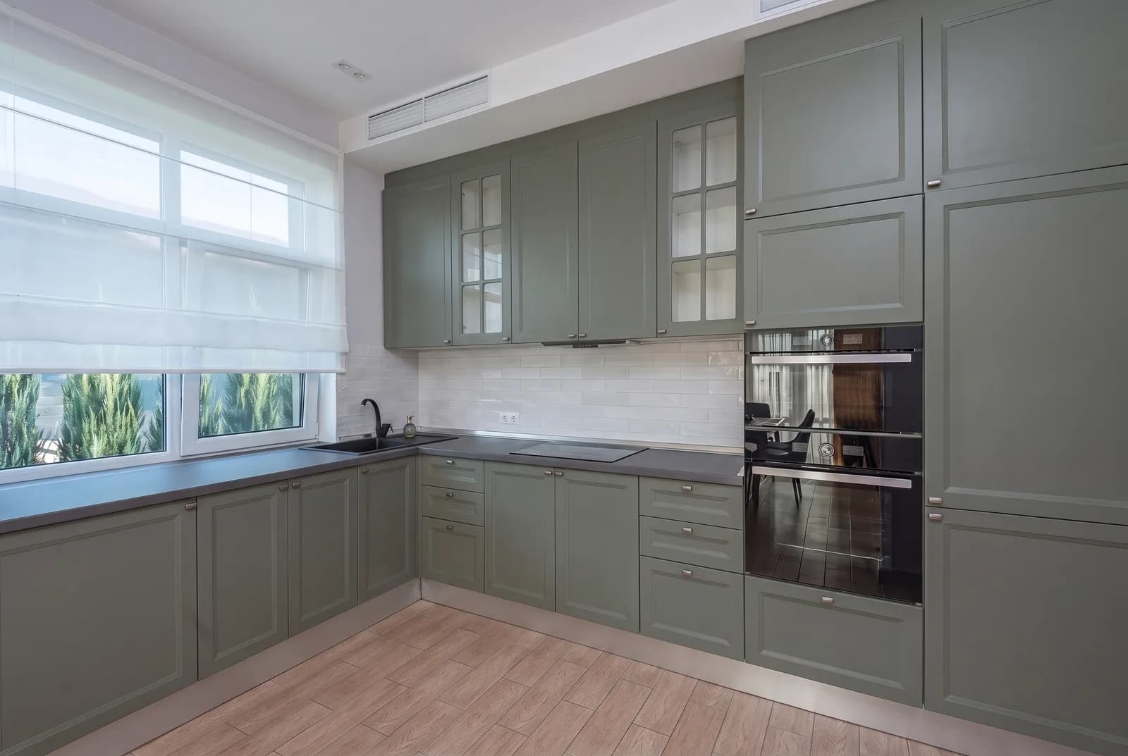Kitchen cabinets rendered in Sherwin-Williams Pewter Green SW 6208, tile, counters and floor unchanged