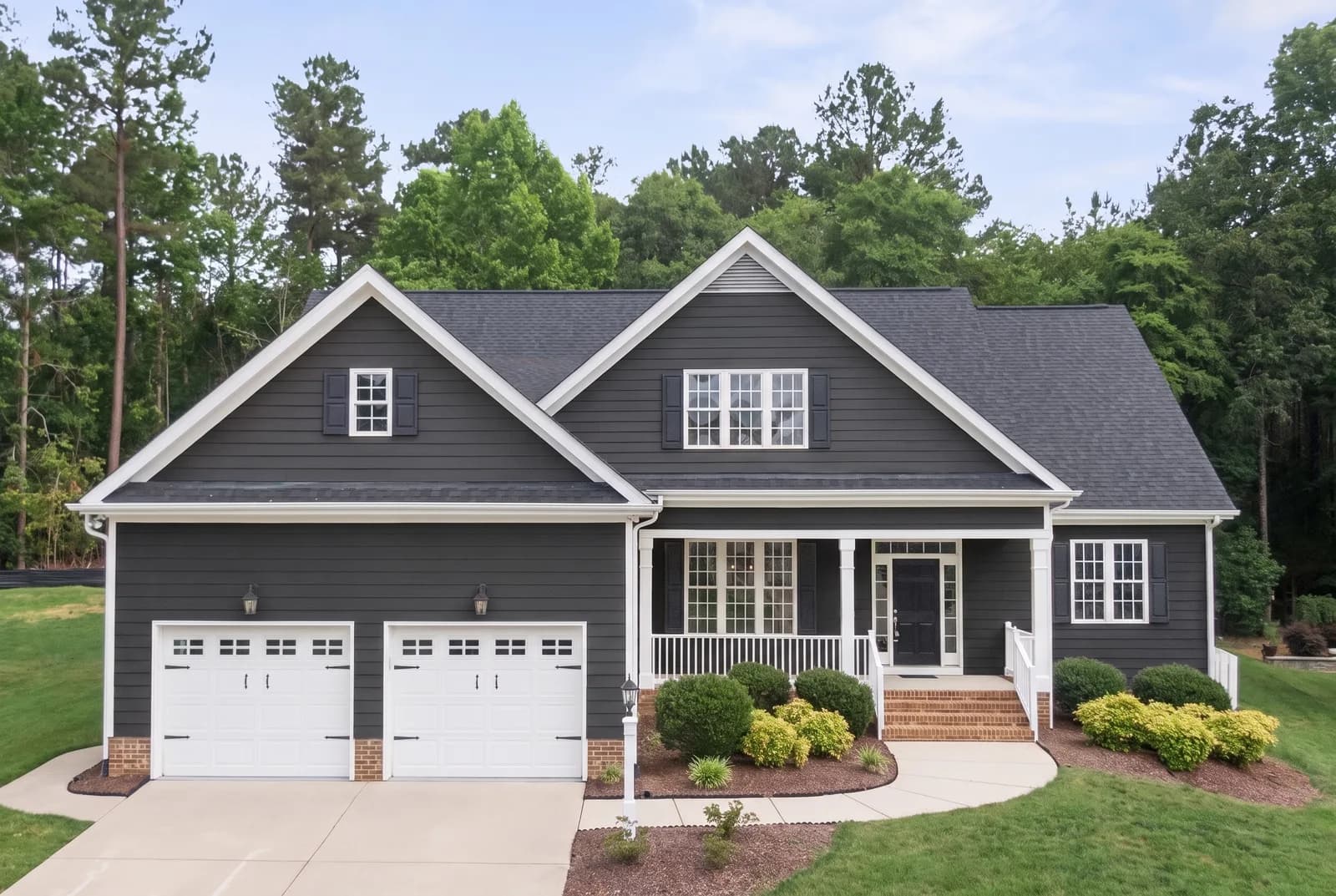 House siding rendered in Sherwin-Williams Tricorn Black SW 6258, roof, shutters and white trim unchanged