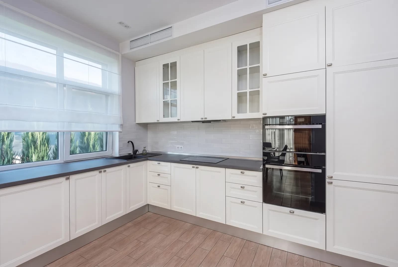 Kitchen cabinets rendered in Sherwin-Williams Pure White SW 7005, tile, counters and floor unchanged