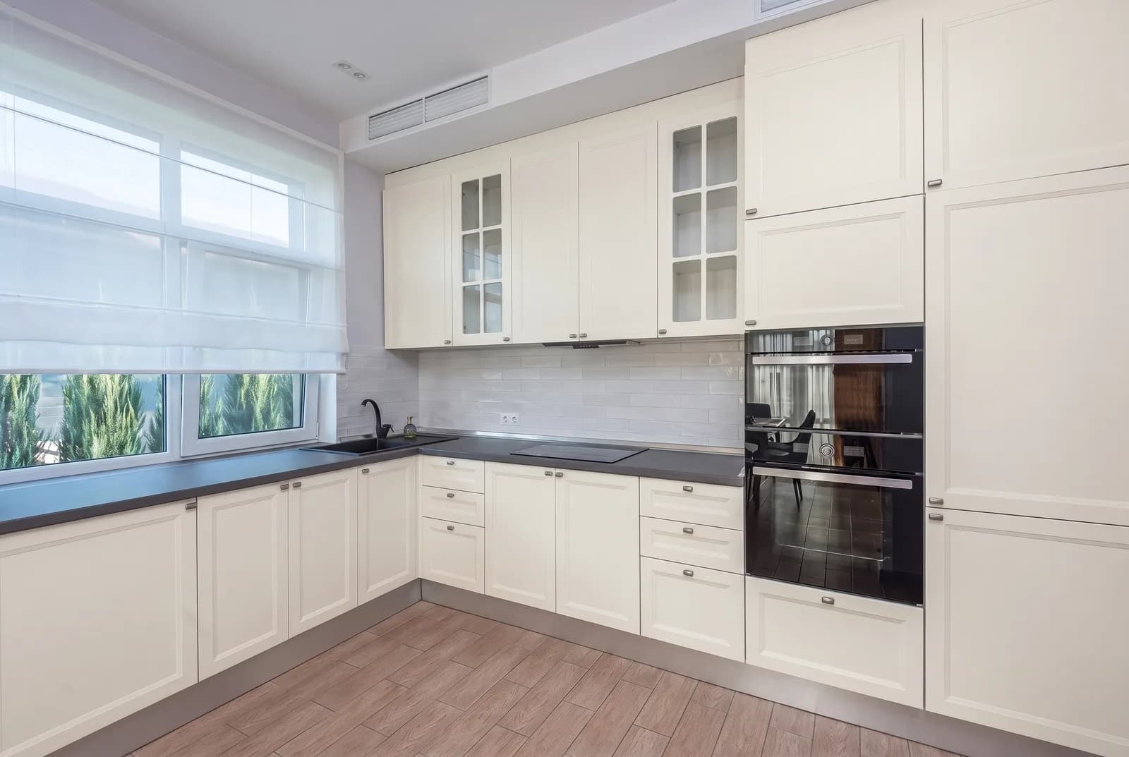 Kitchen cabinets rendered in Sherwin-Williams Greek Villa SW 7551, tile, counters and floor unchanged