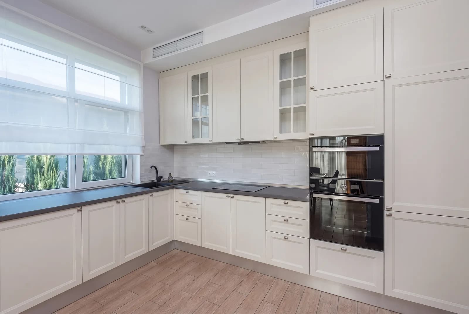Kitchen cabinets rendered in Sherwin-Williams City Loft SW 7631, tile, counters and floor unchanged